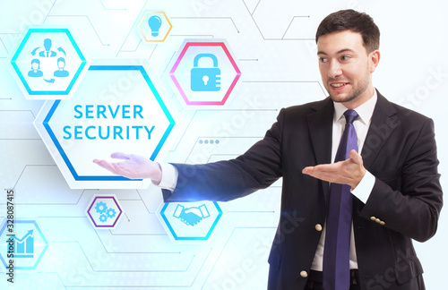 Business, Technology, Internet and network concept. Young businessman working on a virtual screen of the future and sees the inscription: Server security