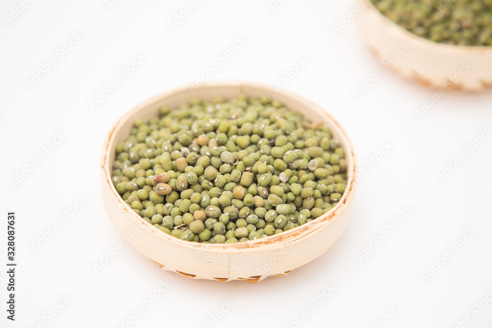 A pile of green beans in the bamboo basket A pile of green beans in the bamboo basket