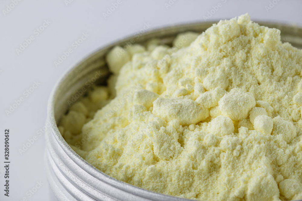 purified sulfur powder on a white acrylic background purified sulfur powder on a white acrylic background