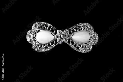 Brooch, jewelry on a black background, isolated