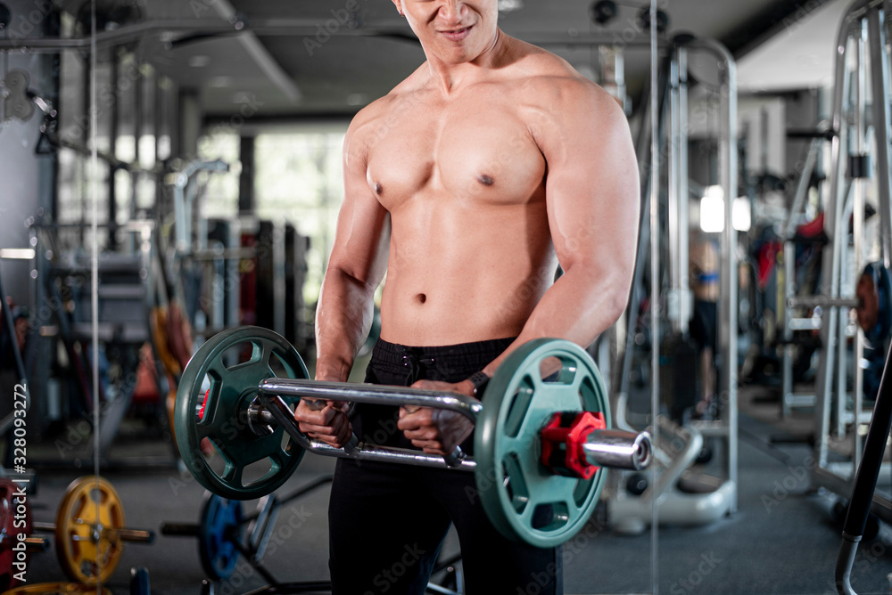 Close up muscular man is exercise in fitness gym Close up muscular man is exercise in fitness gym