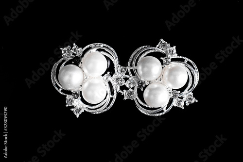 Brooch, jewelry on a black background, isolated