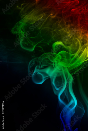 Rainbow colors smoke on black background