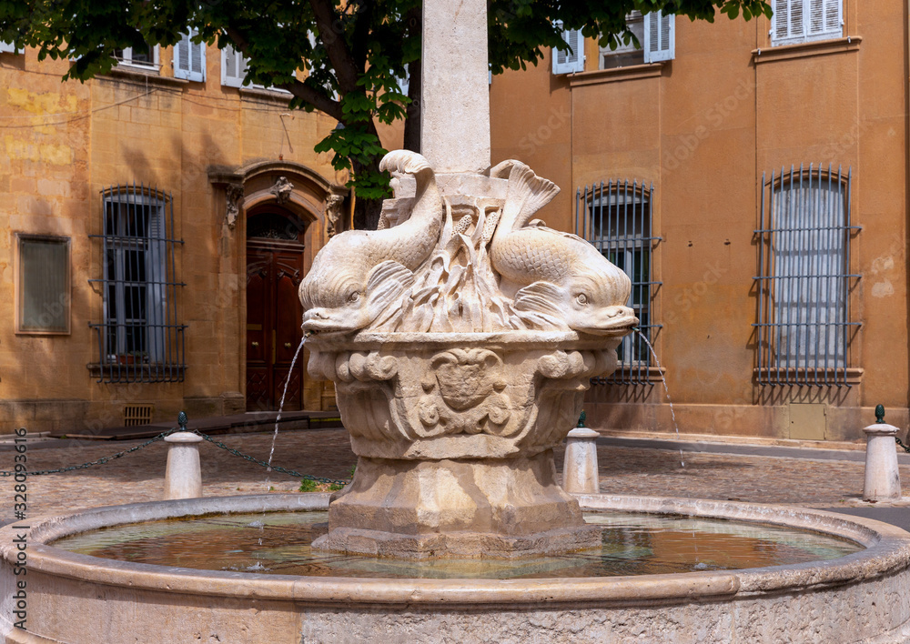 Aix-en-Provence. The square and the fountain of four dolphins on a sunny day.