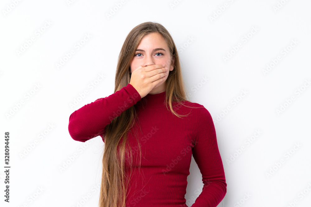 Teenager blonde girl over isolated white background covering mouth with hands Teenager blonde girl over isolated white background covering mouth with hands
