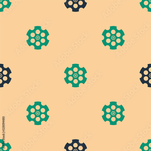 Green and black Revolver cylinder icon isolated seamless pattern on beige background. Vector Illustration