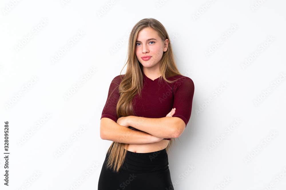 Sport teenager girl over isolated white background with arms crossed Sport teenager girl over isolated white background with arms crossed