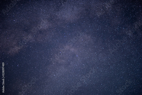 The stars and the milky way in the dark sky at night are very beautiful.