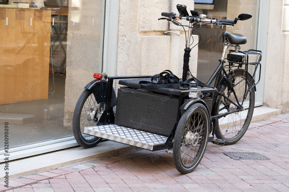black cargo bike bicycle basket modern fashion city street urban transportation