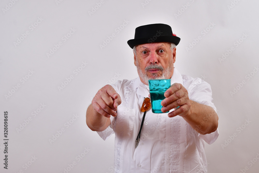 Old man offering a glass of water.Elderly gentleman offers a drink of water.Senior man holding a glass of water and pointing at the camera. Old man offering a glass of water.Elderly gentleman offers a drink of water.Senior man holding a glass of water and pointing at the camera.