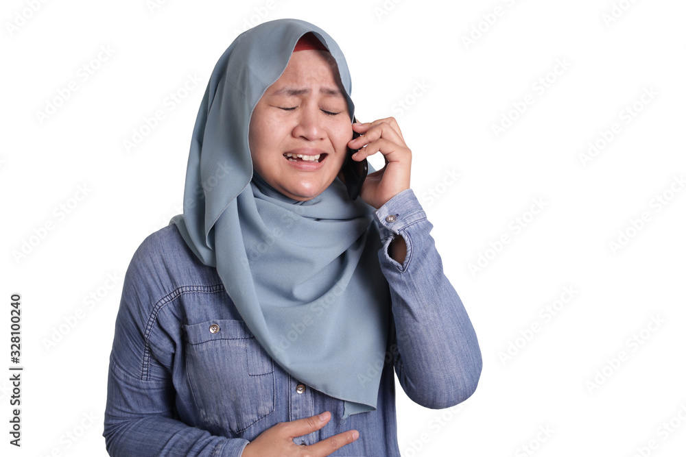 Muslim Woman Get Bad News when Talking on Phone, Sad Crying Expression Muslim Woman Get Bad News when Talking on Phone, Sad Crying Expression