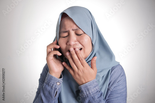 Muslim Woman Get Bad News when Talking on Phone, Sad Crying Expression