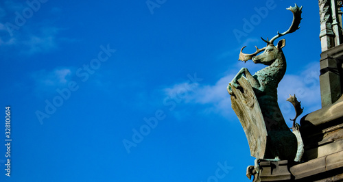details of a statue in Edinburgh city with blue sky with a space for your text