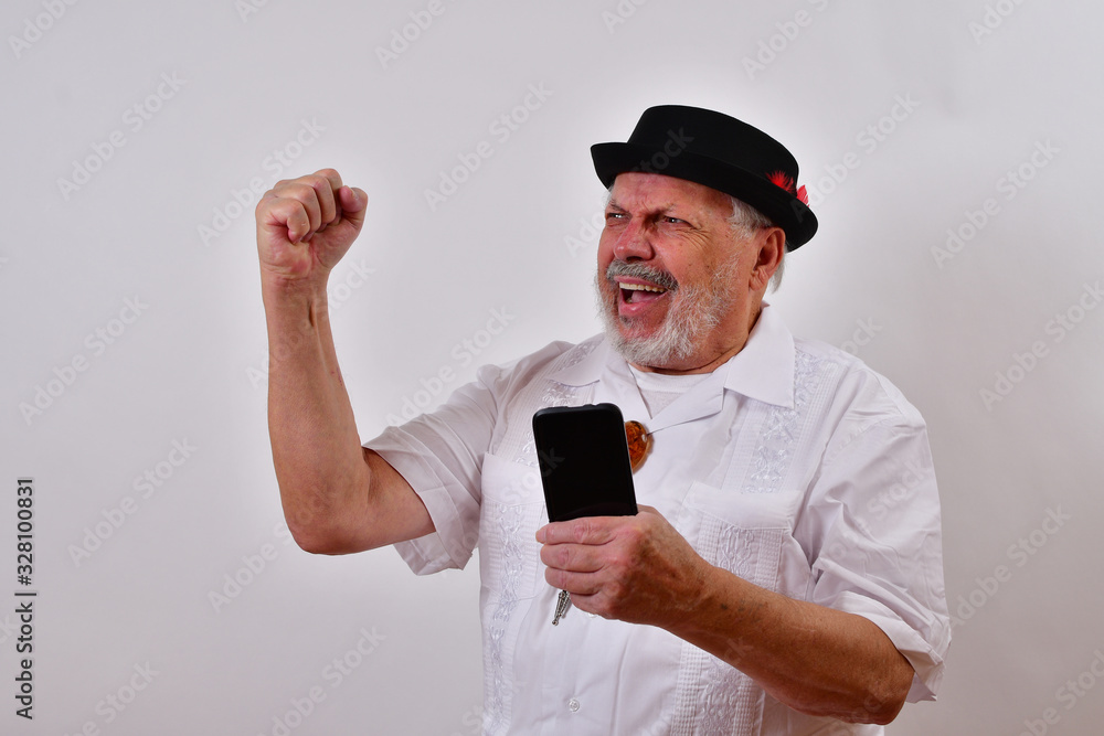 Victory!.Happy old man giving the closed fist victory sign.Elderly gentleman is delighted and smiling.Senior man very happy and smiling. Victory!.Happy old man giving the closed fist victory sign.Elderly gentleman is delighted and smiling.Senior man very happy and smiling.