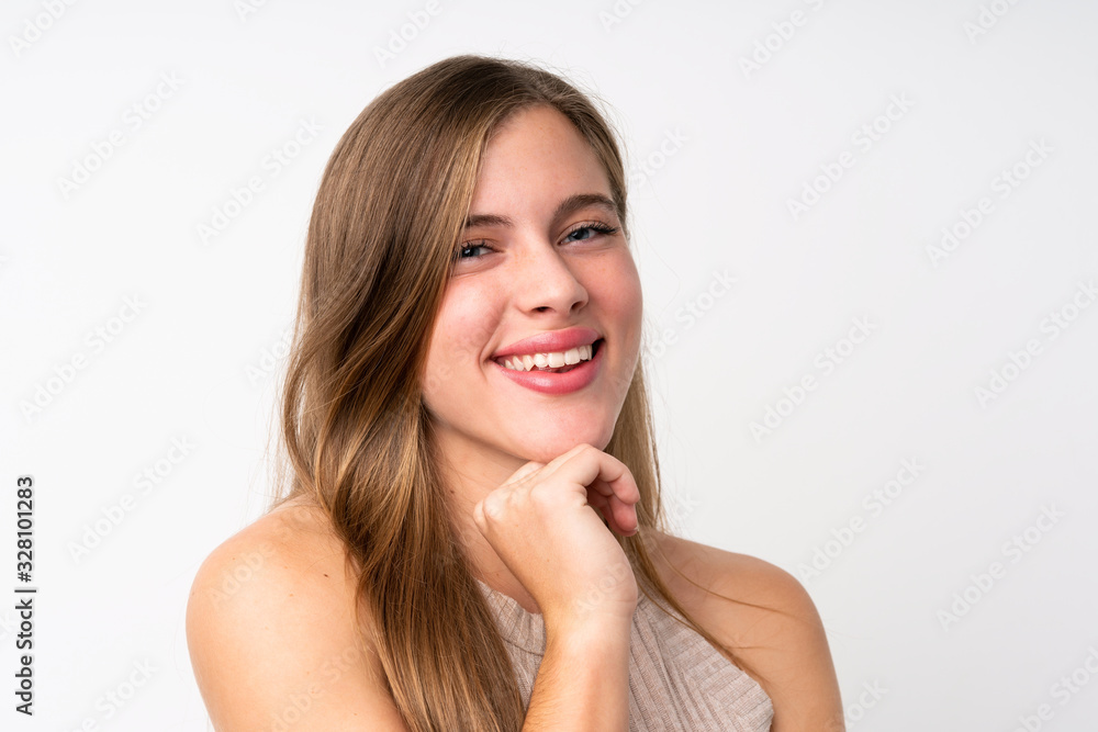 Portrait of beautiful teenager blonde girl over isolated white background Portrait of beautiful teenager blonde girl over isolated white background