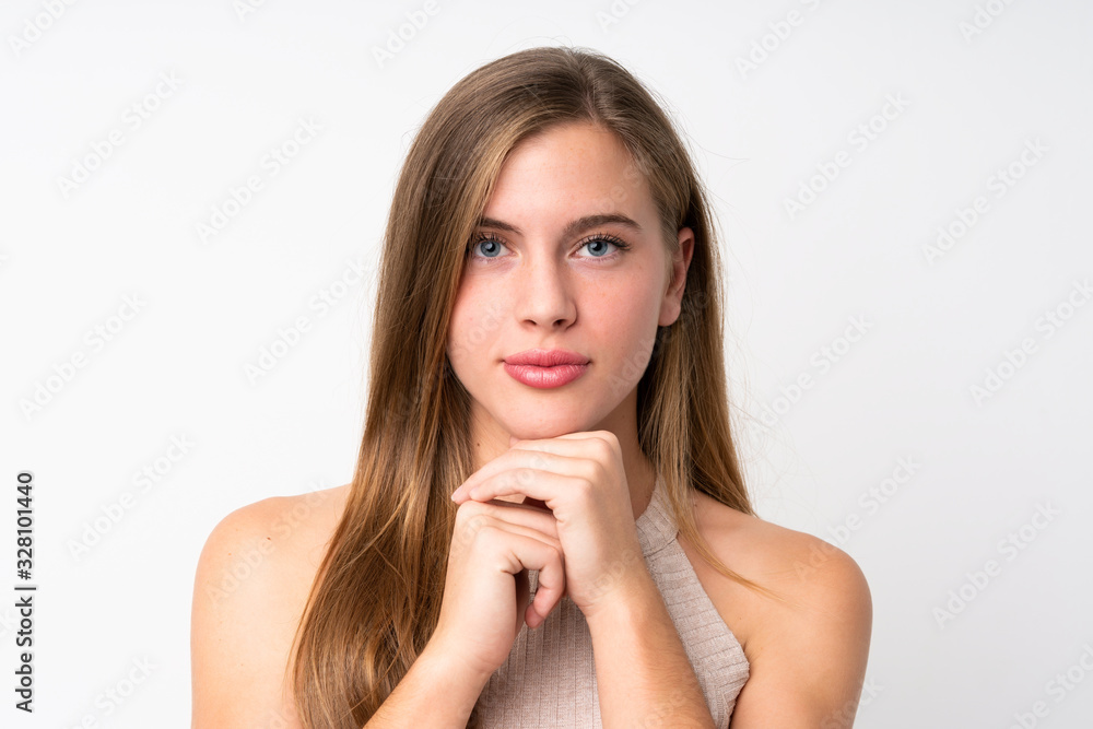 Portrait of beautiful teenager blonde girl over isolated white background Portrait of beautiful teenager blonde girl over isolated white background