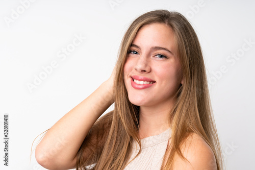 Portrait of beautiful teenager blonde girl over isolated white background