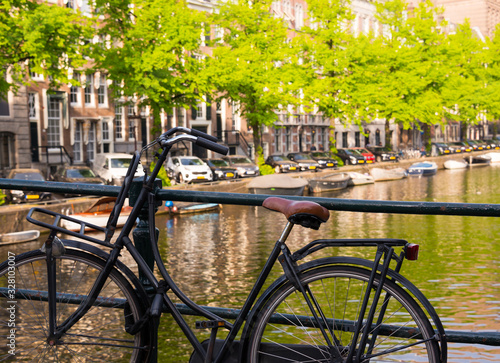 Wallpaper Mural Amsterdam city in Netherlands with bycicles beside a canal Torontodigital.ca