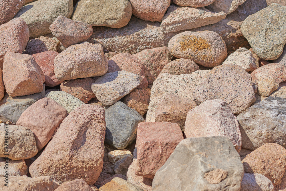 Pile of big rocks boulders. Background of the brown stones Pile of big rocks boulders. Background of the brown stones