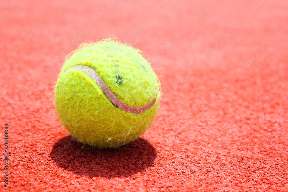 Tennis ball on tennis court. World Tennis Day, 3 of March. Sport concept