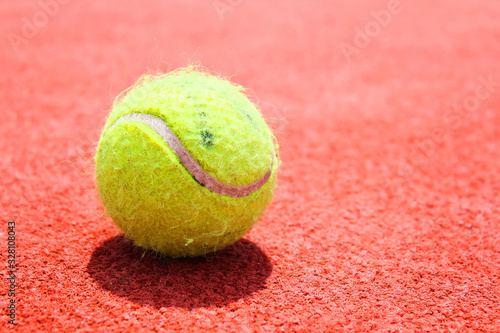 Tennis ball on tennis court. World Tennis Day, 3 of March. Sport concept