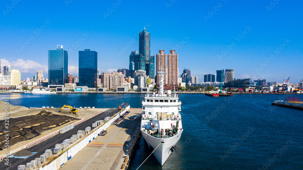 Aerial view Kaohsiung city with blue sky background and Kaohsiung harbor, Taiwan.