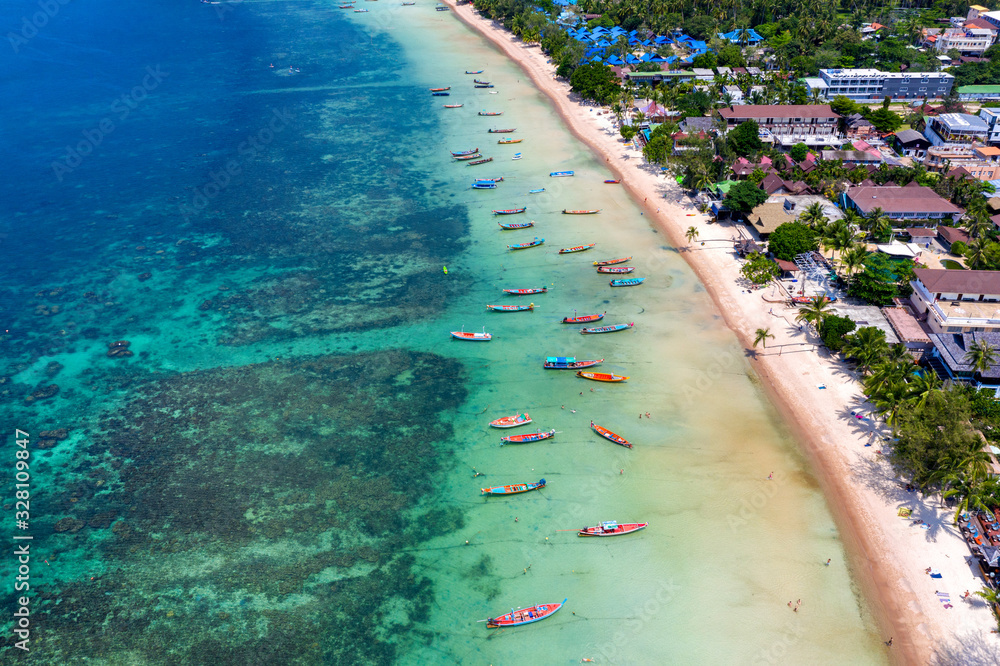 Aerial view of Long tail boats on the sea at Koh Tao island, Thailand.