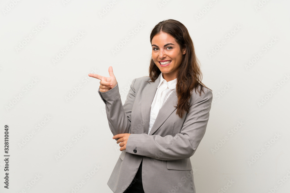 Young business woman over isolated white background pointing finger to the side Young business woman over isolated white background pointing finger to the side