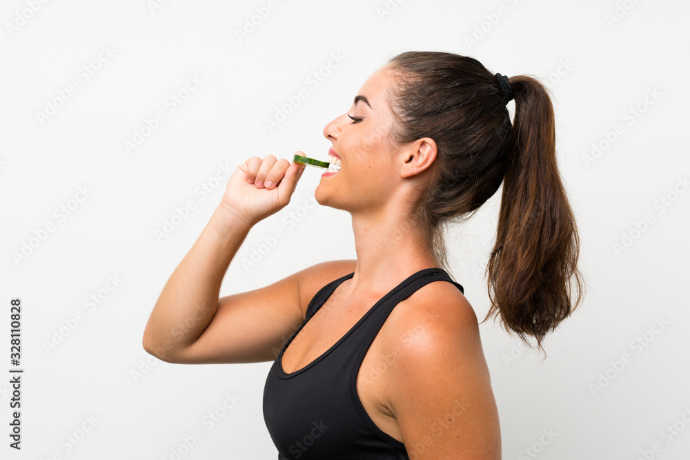 Beautiful young woman holding slices of cucumber Beautiful young woman holding slices of cucumber