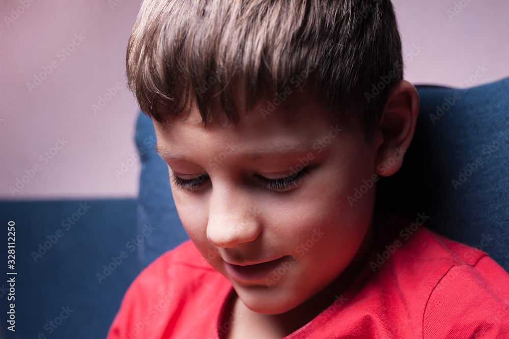 close portrait of a cute boy with a smile in a red t-shirt close portrait of a cute boy with a smile in a red t-shirt