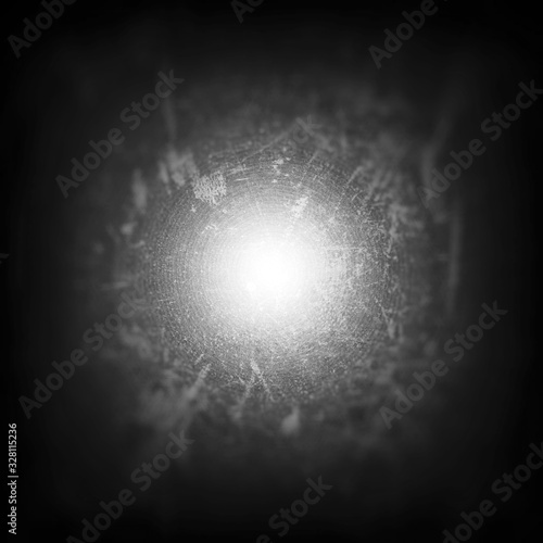 abstract background with cracked  wall motif and bright light on the middle