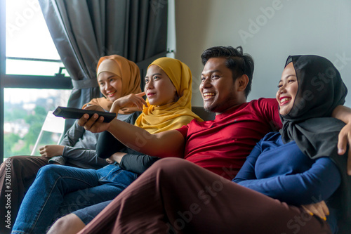Polygamy concept husband with 3 wife at the sofa