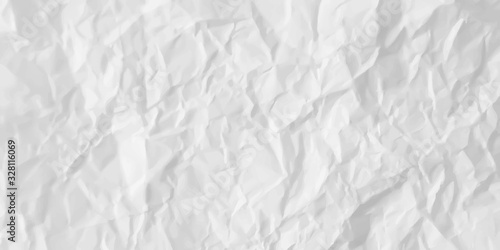 Texture of sheet of white crumpled paper. Wrinkled paper background