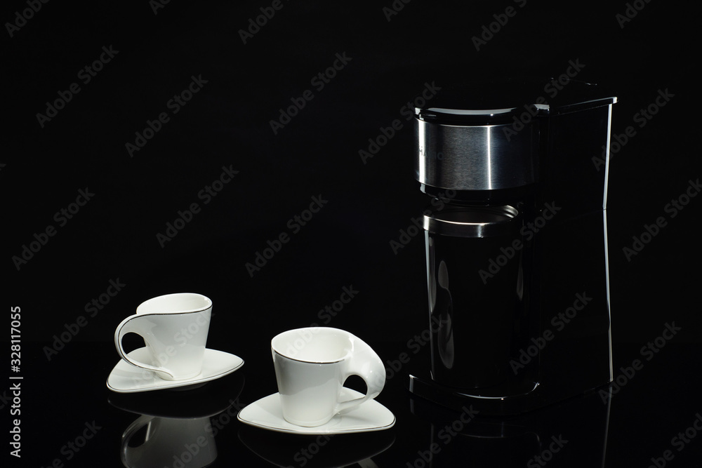 Fototapeta premium Espresso coffee machine on the black background