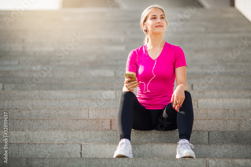 beautiful young woman in sportswear goes in for sports