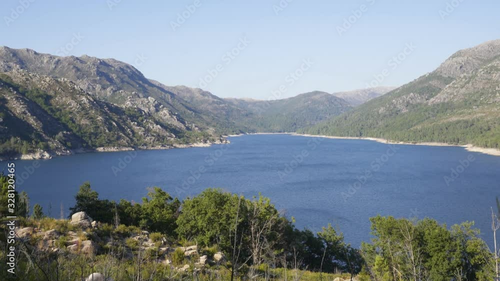Lake of dam in Vilarinho da Furna beautiful nature landscape in Geres national park, in Portugal Lake of dam in Vilarinho da Furna beautiful nature landscape in Geres national park, in Portugal