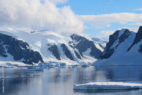 Icebergs and mountains of the Antarctic Peninsula in the Gerlache Strait in the Danco Coast, Antarctica