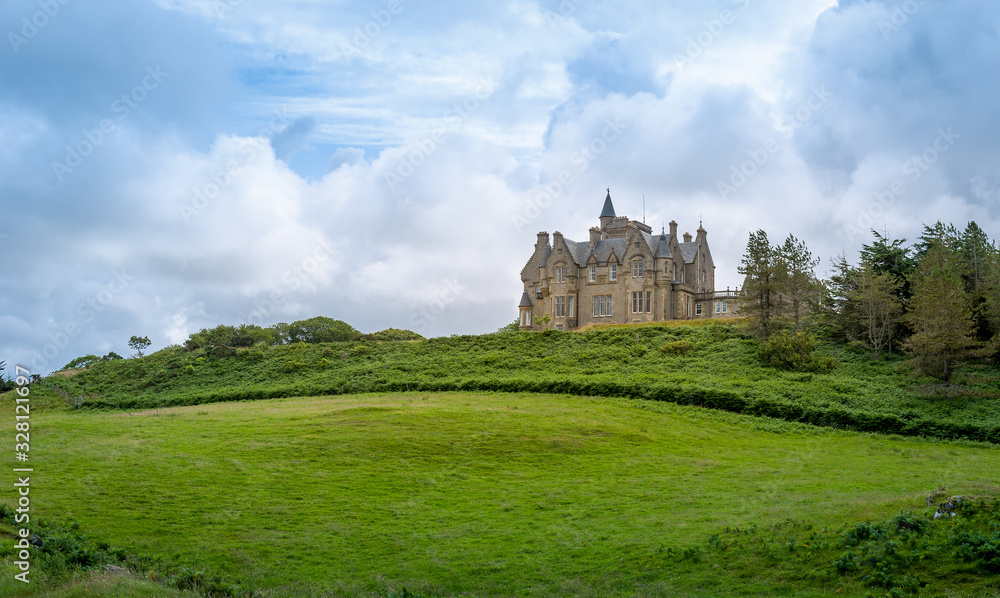 Green fields of Glengorm Castle - travel destination at Mull island, Scotland.
