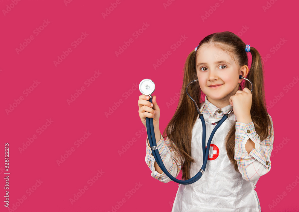 Happy girl playing a doctor - over a pink background Happy girl playing a doctor - over a pink background