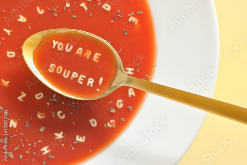 Soup With Letter Noodles On Spoon