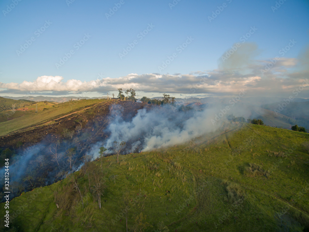 Grassland fire. Aerial view smoke of wildfire. Fire in the bush of Brazil. 