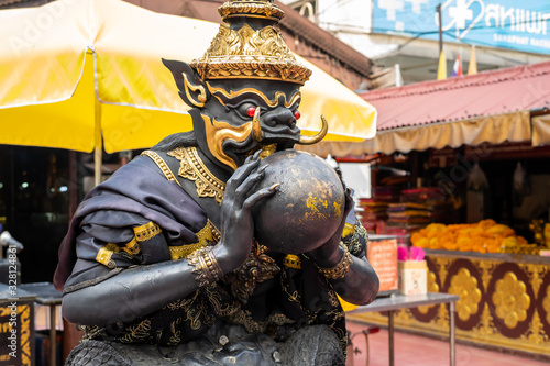 Phra Rahu statue At Huai Khwang Market, Bangkok, Thailand photo