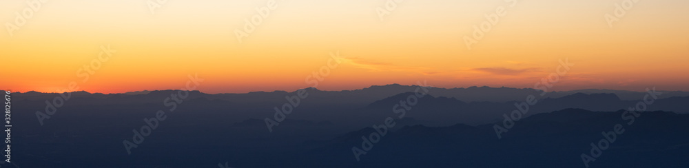 Sunset over Arizona mountain silhouettes 