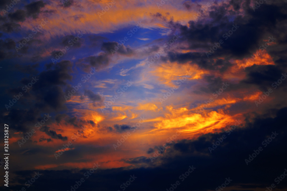 Beautiful orange  blue and dark grey colors on the sky from a sunset