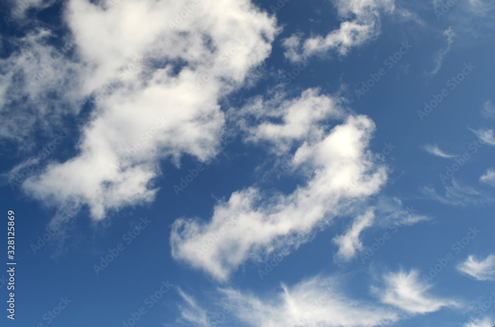 Fluffy white clouds on a beautiful blue sky