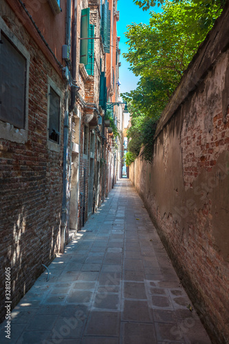 Venice s narrowest street between brick walls  Italy