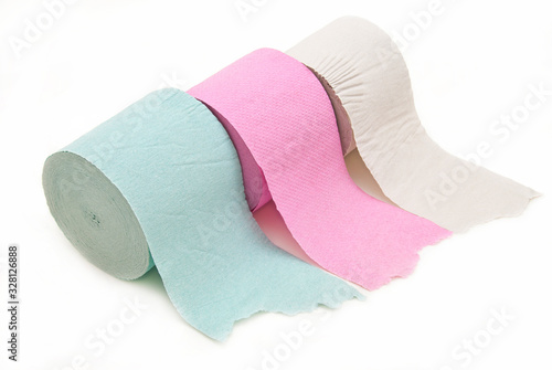 Toilet paper in three colors on a white background.