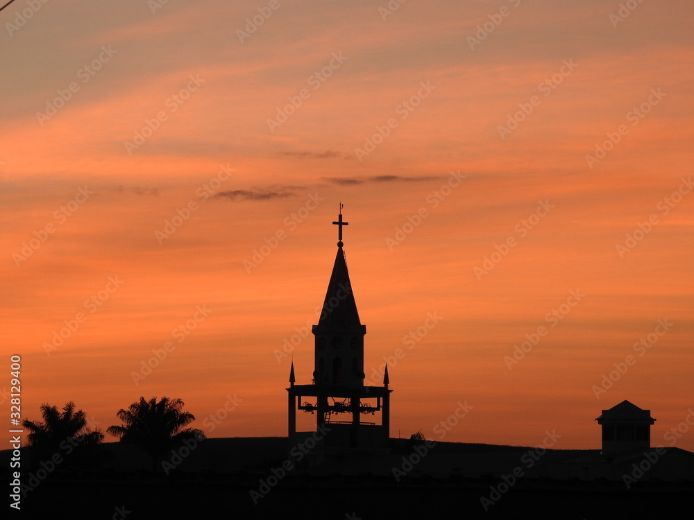 silhouette of church at sunset