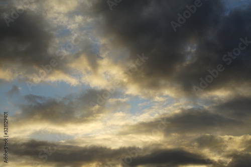Clouds with sunlight and blue color during evening sunset 