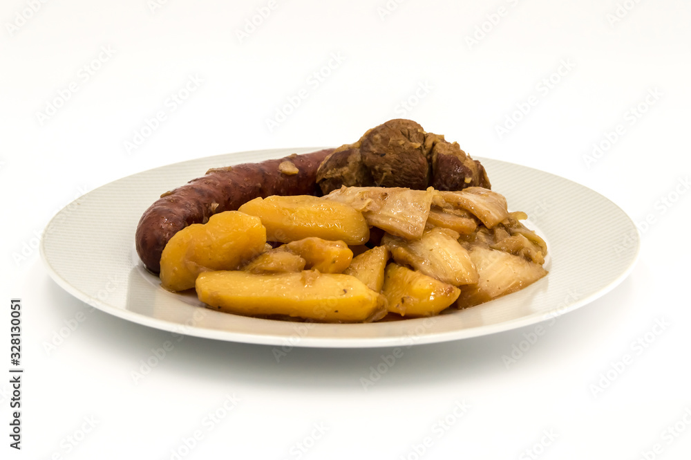 Plate of burnt white cabbage with sausage Plate of burnt white cabbage with sausage
